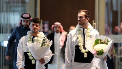PSG's Juan Bernat and Fabian Ruiz after arriving in Riyadh. Reuters