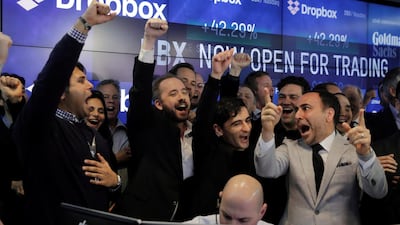 Dropbox Inc. co-founders Drew Houston and Arash Ferdowsi celebrate while watching the initial trade of Dropbox as it is listed for the company's initial public offering (IPO) at the Nasdaq Market Site in New York City. Lucas Jackson/Reuters