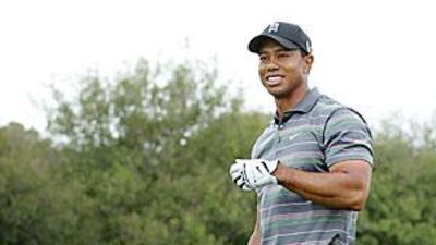Tiger Woods is all smiles after being introduced on the first tee at Augusta yesterday.