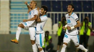 Mohamed Zidan, left, after scoring the goal to make it 2-1 to Baniyas. Christopher Pike / The National