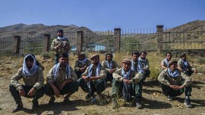 Afghan youths who will be inducted in Afghan Security forces sit along a road in Panjshir province of Afghanistan on August 15, 2021. AFP via Getty Images