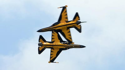 South Korea’s Black Eagles aerobatics team on KAI T-50B aircraft perform a flypast at the Singapore Airshow. Roslan Rahman / AFP