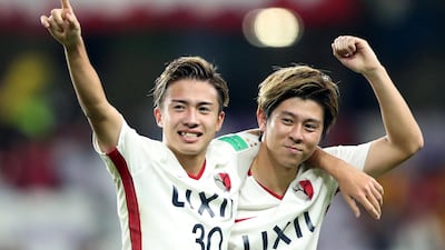 Kashima Antlers' Hiroki Abe celebrates scoring their third goal with Koki Anzai. Reuters
