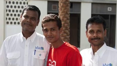 Sumon Azad, centre, is one of the four teenagers brought in the UAE by the Maria Cristina Foundation. Azad joins Raufikul Hussain, left, and Shafiqul Islam, who took jobs, through the same charity.