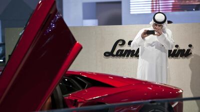A visitor at 2013’s Dubai motor show. Antonie Robertson / The National