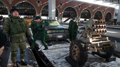 Russian soldiers stand next to a homemade mortar. AP Photo