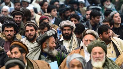 Afghanis listen to presidential candidate Zalmay Rasool in Kabul on February 3, 2014. Afghanistan’s campaign to elect Hamid Karzai’s successor kicked off, as the killing of a front-runner’s aides highlighted the security threat to the poll. Gunmen last Saturday shot dead two aides of Abdullah Abdullah, a former foreign minister seen as a strong contender, in the western city of Herat, officials said. Wakil Kohsar / AFP photo