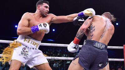 Jake Paul, right, and Tommy Fury, in action. AP