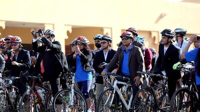 Each team consisted of four members wearing formal clothes, the teams cycled three laps with a total distance of 22.8km