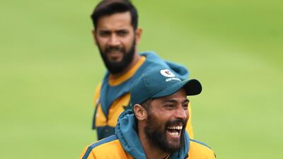Mohammad Amir of Pakistan shares a joke during training. Getty