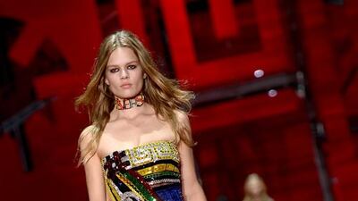 VERSACE, FEBRUARY 27, 8PM, MILAN. Donatella Versace took the digital world to heart for her latest collection, incorporating the label’s well-known bling with @ and hashtag symbols, emojis and emoticons. / Filippo Monteforte / AFP photo