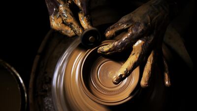 An Indian craftsman makes earthen lamps (or Diya) at his workshop ahead of the upcoming Diwali festival in Bengaluru, India. EPA