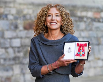 Kelly Hoppen poses following a ceremony at Windsor Castle in London, where she was made a Commander of the Order of the British Empire (CBE) in November 2021. AFP
