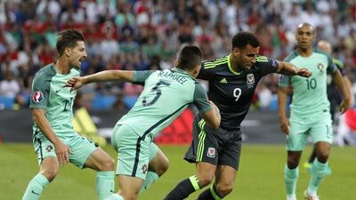 Hal Robson-Kanu (C) of Wales in action during the Uefa Euro 2016 semi-final match between Portugal and Wales at Stade de Lyon in Lyon, France, 06 July 2016. Abedin Taherkenareh / EPA
