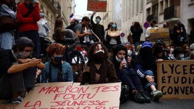 French youths stage a sit-in to block a street outside Sciences Po university in Paris as part of nationwide protests demanding better school conditions. Reuters