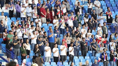 Supporters of the Philippines sing the national anthem before their Asian Cup match against South Korea in Dubai. All photos by Pawan Singh / The National
