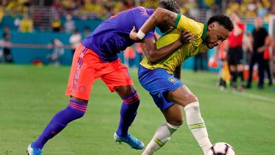 Brazil's foward Neymar Jr. (R) and Colombia's defender Luis Manuel Orejuela vie for the ball during their international friendly football match between Brazil and Colombia at Hard Rock Stadium in Miami, Florida, on September 6, 2019. / AFP / RHONA WISE