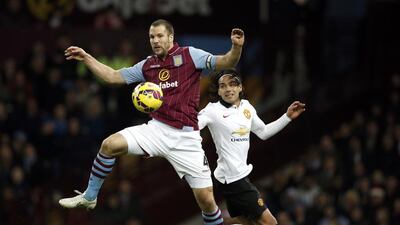 Manchester United's Colombian striker Radamel Falcao, right, challenges Aston Villa's Dutch defender Ron Vlaar during their English Premier League match at Villa Park in Birmingham, England, on December 20, 2014. Adrian Dennis / AFP
