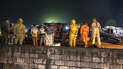 The wreckage of Lion Air Flight RPC 5880 is seen at the runway of Ninoy Aquino International Airport after it crashed in Manila. Getty Images