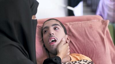 Alya Ali with her son Abdulrahman at her home in Abu Dhabi. Reem Mohammed / The National