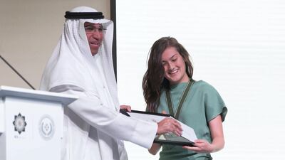 Dr. Zamzam presents Ms. Watkins the second Haitham Zamzam Al Hammadi Medal of International Friendship.