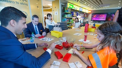 Visitors building their own Lego designs. Leslie Pableo for The National