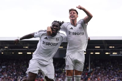 Fulham's Calvin Bassey, left, and Tom Cairney celebrate at Craven Cottage. AP