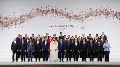 Leaders pose for the family photo at the G20 Summit. AP