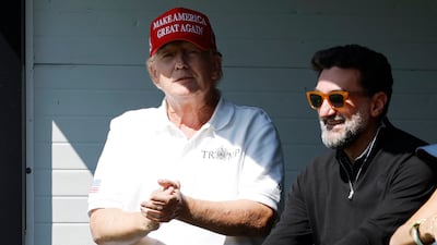 Mr Trump stands next to Yasir Al Rumayyan, chair of Saudi Aramco. Photo: USA TODAY Sports