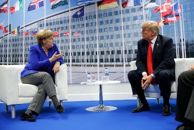 President Donald Trump meets with German Chancellor Angela Merkel during their bilateral meeting at the NATO Summit in Brussels, Belgium, Wednesday, July, 11, 2018. (AP Photo/Pablo Martinez Monsivais)