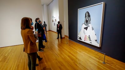 Visitors view the Smithsonian's National Portrait Gallery official portrait of Ms Obama at the High Museum of Art in Atlanta. EPA