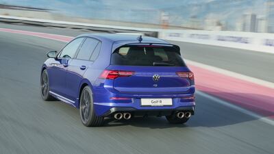 The R features dual left and right chrome exhaust pipes.