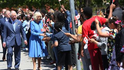 The Royal couple greet students during a visit at Assumption Catholic school on May 18, 2022 in Ottawa. AFP