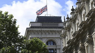 The Union flag flies at half mast in Whitehall, central London, on June 4, 2017, a day after terrorist attacks on London Bridge and at Borough Market. Stefan Rousseau / PA via AP