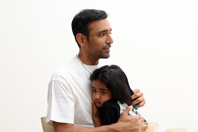 Uthappa with his daughter, Trinity. Chris Whiteoak / The National