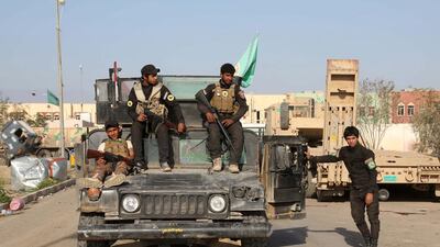 Young Shiite volunteer militia fighters pose for a photo before battle against ISIL fighters in the city of Tikrit. Khalid Mohammed, File/AP Photo