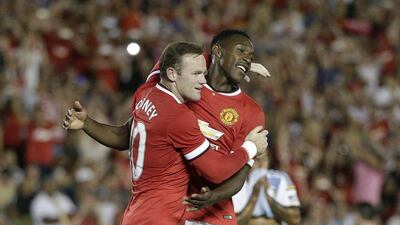 Wayne Rooney celebrates with Danny Welbeck after scoring a goal during Manchester United's 7-0 win over LA Galaxy on Wednesday night in Pasadena, California. AP Photo / July 23, 2014