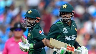 Pakistan's captain Babar Azam (R) and Mohammad Rizwan run between the wickets during the 2023 ICC Men's Cricket World Cup one-day international (ODI) match between India and Pakistan at the Narendra Modi Stadium in Ahmedabad on October 14, 2023. (Photo by Punit PARANJPE / AFP) / -- IMAGE RESTRICTED TO EDITORIAL USE - STRICTLY NO COMMERCIAL USE -- - -- IMAGE RESTRICTED TO EDITORIAL USE - STRICTLY NO COMMERCIAL USE --