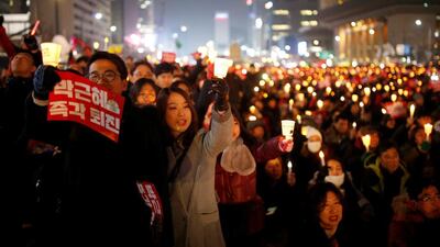 People attend a protest demanding South Korean president Park Geun-hye’s resignation in Seoul on December 31, 2016. Kim Hong-ji / Reuters