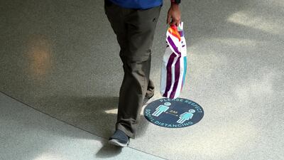 Covid-19 safety measures at Times Square in Dubai. Authorities are urging people to follow the rules. Chris Whiteoak / The National