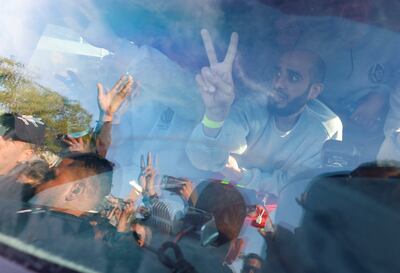 Freed Palestinian detainees make their way to Ramallah in a bus on Saturday. Reuters
