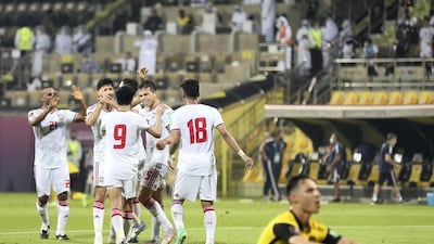Fabio De Lima celebrates his second goal with UAE teammates. Chris Whiteoak / The National