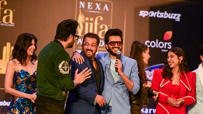 Manish Paul and Riteish Deshmukh hug Salman Khan at the IIFA press conference; all three actors will host the IIFA Awards on June 4.