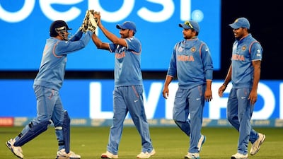 Mohammed Shami, second from left, has spearheaded an Indian attack that has bowled out their opponents in all seven matches they have played at this World Cup. William West / AFP