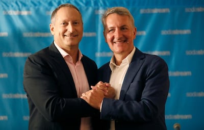 PepsiCo CEO Ramon Laguarta (R) and CEO of SodaStream, Daniel Birnbaum (L), shake hands while posing during a joint news conference in Tel Aviv. EPA