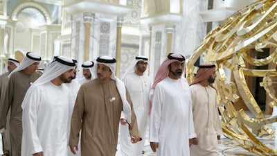 ABU DHABI, UNITED ARAB EMIRATES - March 10, 2019: HH Sheikh Abdullah bin Salem Al Qasimi, Deputy Ruler of Sharjah (L), HH Sheikh Mansour bin Zayed Al Nahyan, UAE Deputy Prime Minister and Minister of Presidential Affairs (2nd L), HH Sheikh Ammar bin Humaid Al Nuaimi, Crown Prince of Ajman (3rd L) and HH Sheikh Mohamed bin Saud bin Saqr Al Qasimi, Crown Prince and Deputy Ruler of Ras Al Khaimah (R), tour the Qasr Al Watan. ( Mohamed Al Raeesi for the Ministry of Presidential Affairs ) ---