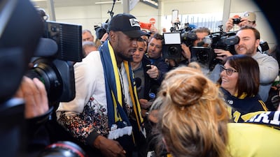 Usain Bolt talks to the media at Sydney international airport. AFP