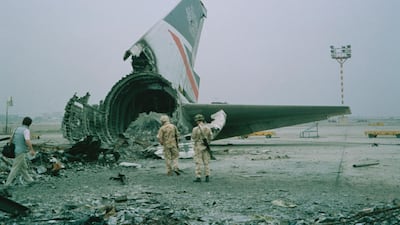 The wreckage of a British Airways Boeing 747-136 at Kuwait City airport, after BA Flight 149 was detained in Kuwait during the Gulf War, 1991. Colin Davey / Getty Images