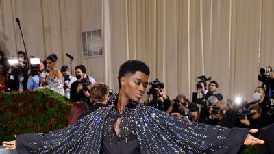 Alton Mason, wearing a sequinned cape. AFP