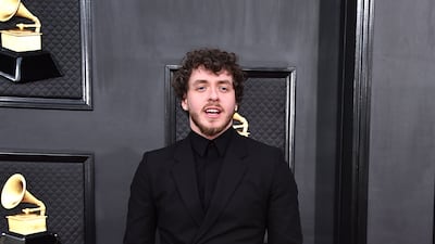 Jack Harlow, wearing a black Givenchy suit. AP